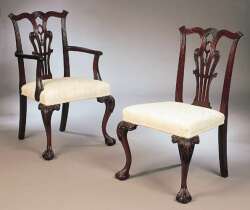 A set of twelve Chippendale style mahogany dining chairs
