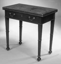 An early George III mahogany foldover side table,
