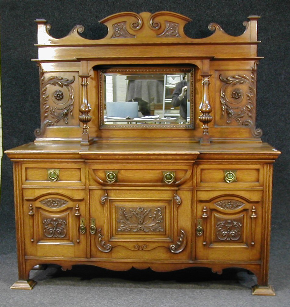 A late Victorian oak sideboard,