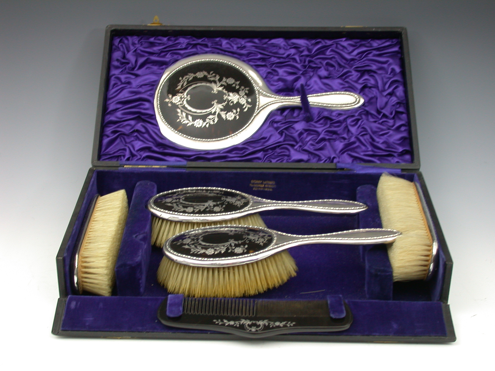 A six-piece dressing table set,