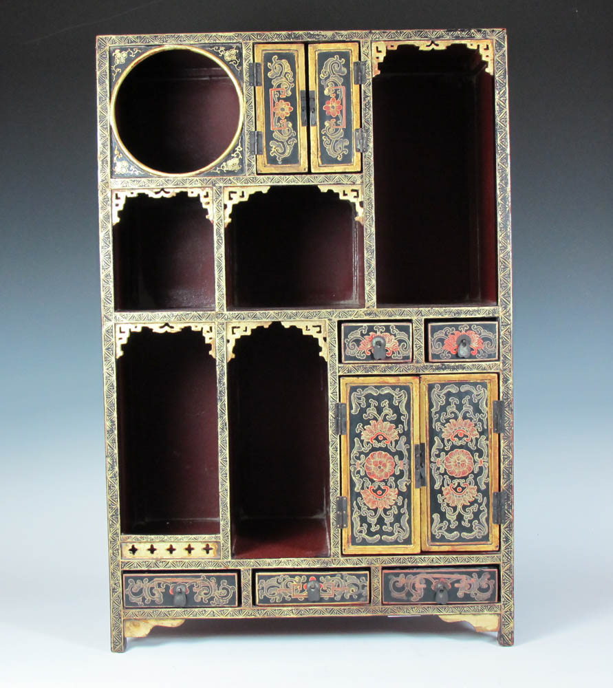 A Chinese painted lacquer display cabinet