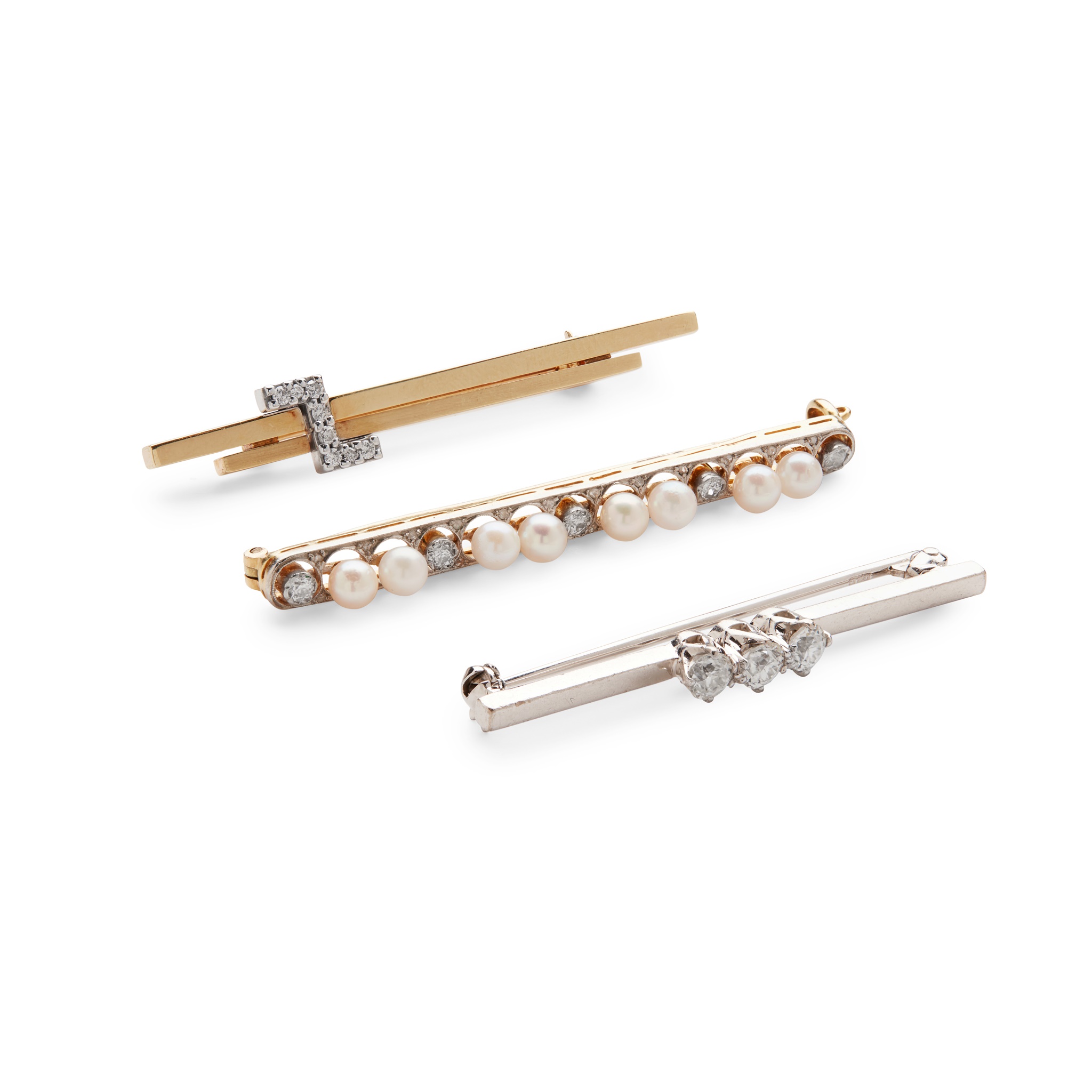 A collection of diamond and pearl brooches