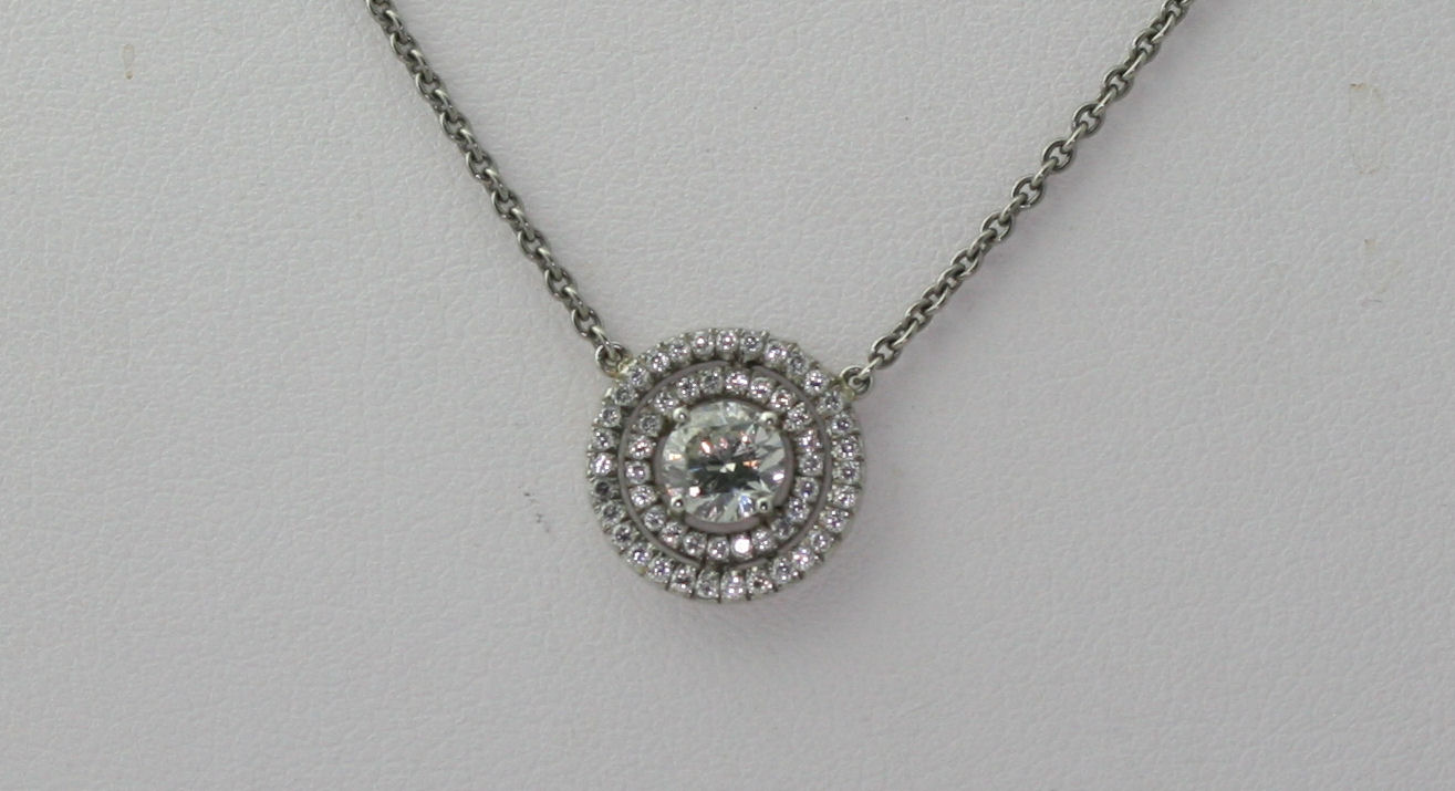 A diamond cluster pendant with chain