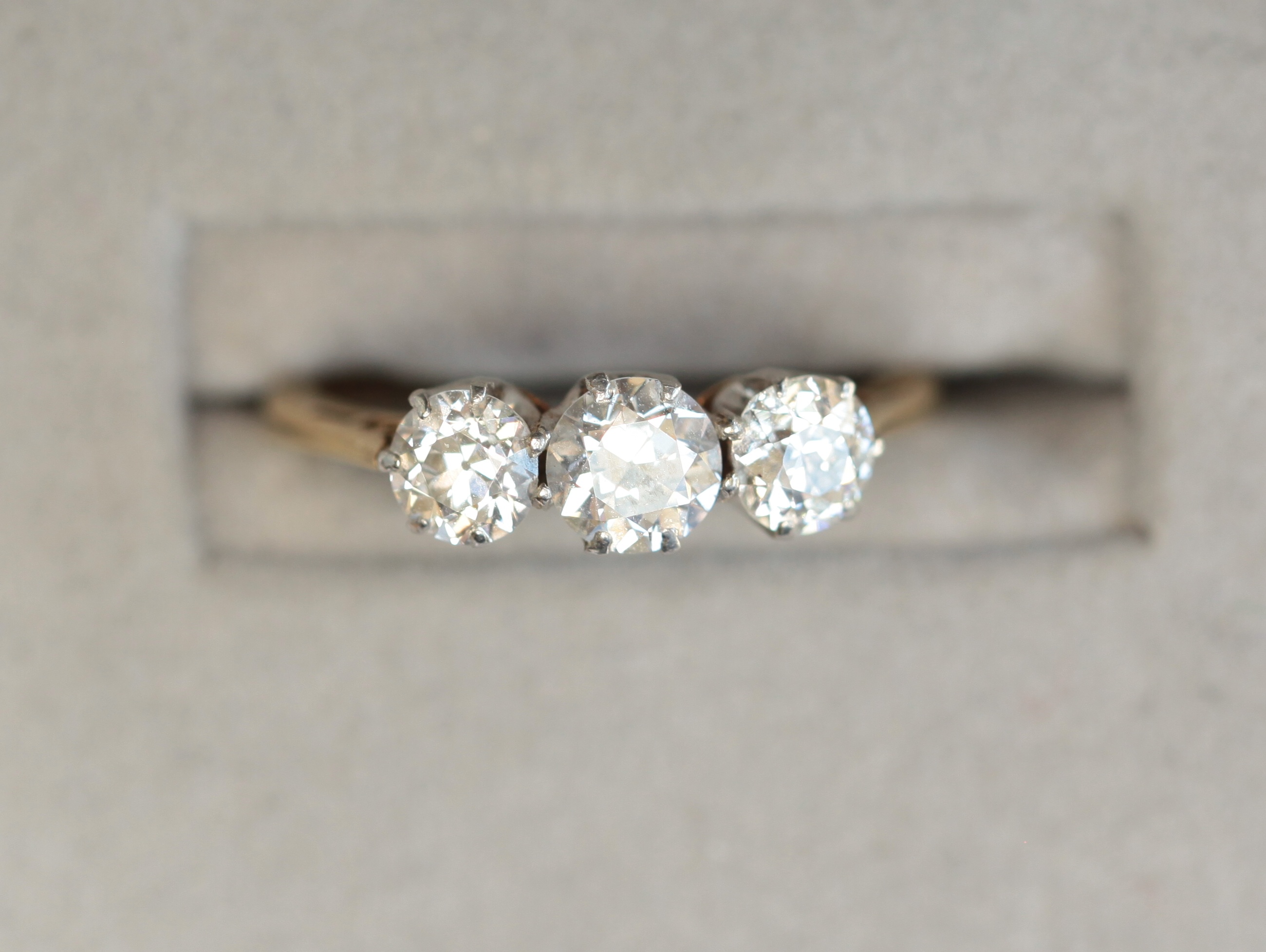 An 18ct gold mounted diamond three-stone ring