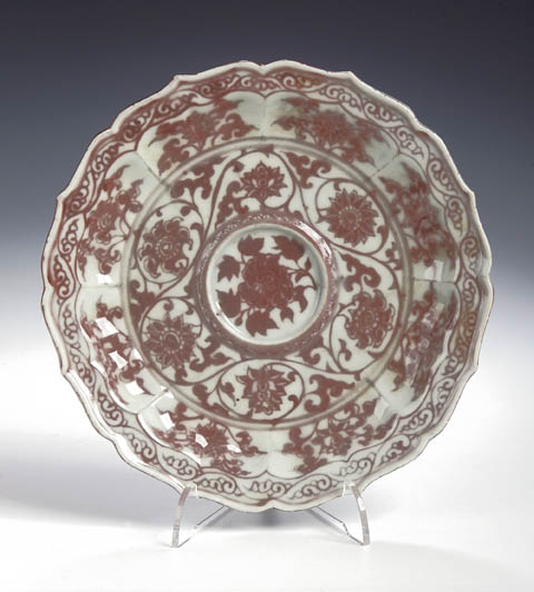 Sold for £38,000 A rare Chinese porcelain circular scalloped underglaze copper red cup stand, Yuan, early Ming dynasty