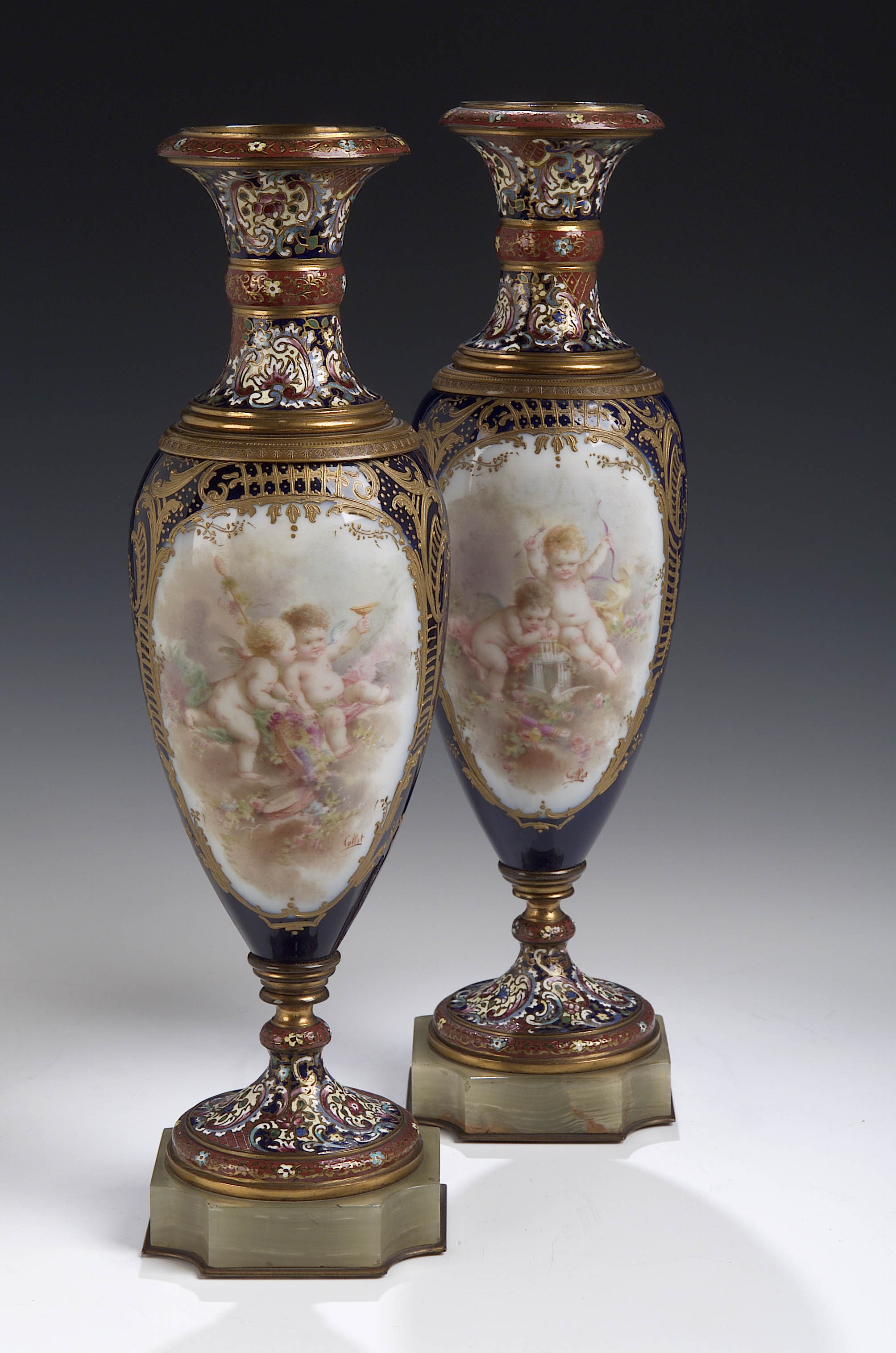 A pair of late 19th century French porcelain, cloisonne, enamel and onyx baluster vases