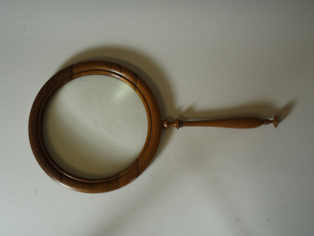 A large rosewood magnifying glass