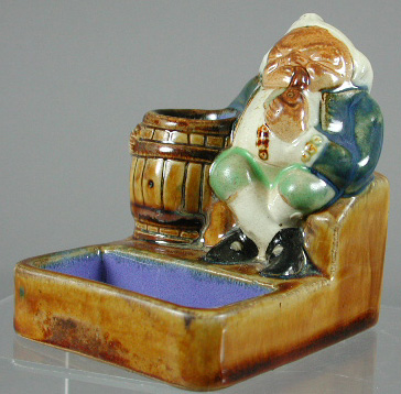 A Royal Doulton Lambeth matchstand and ashtray