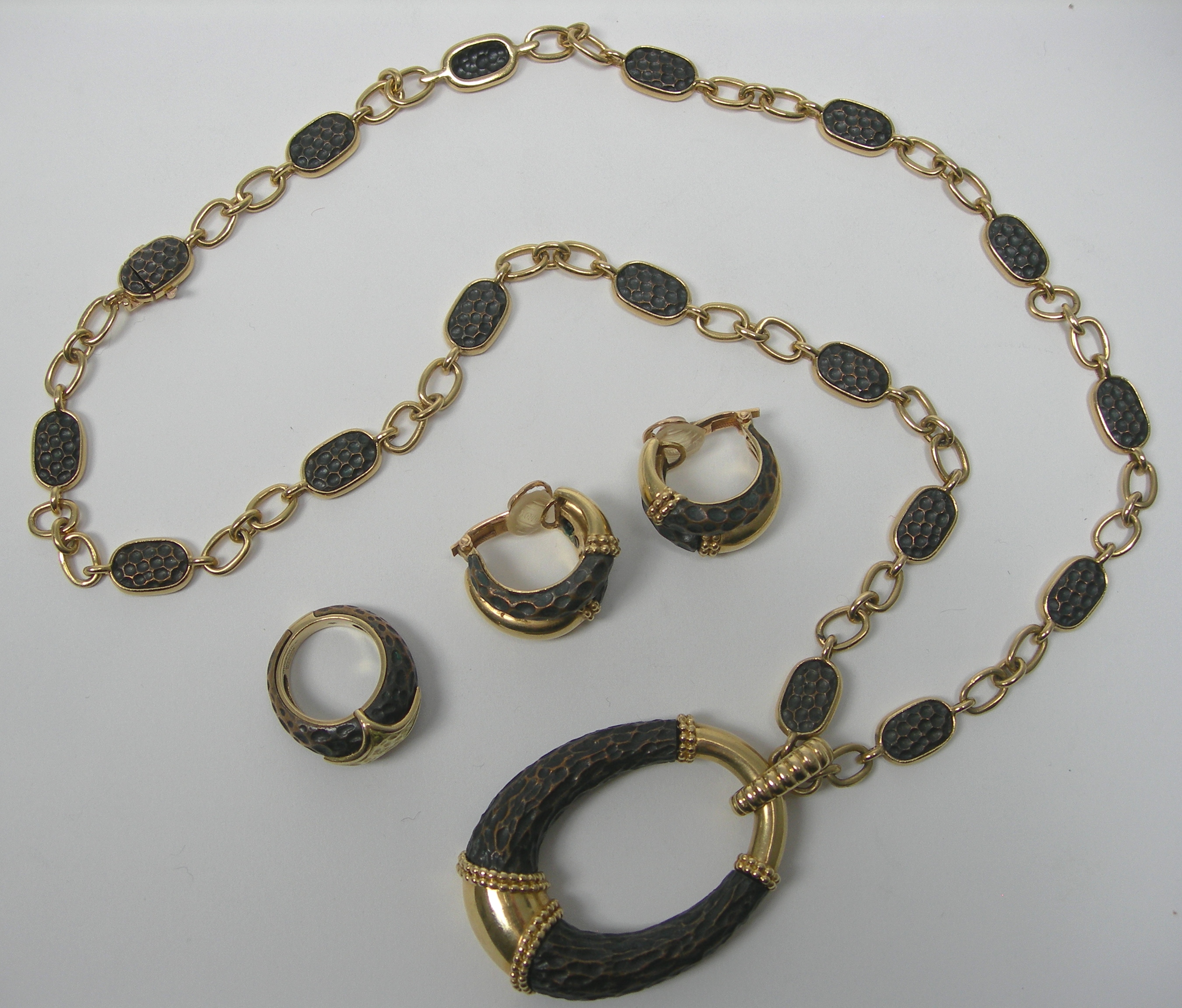 BOUCHERON - a 1970's 18ct gold and bronze suite,