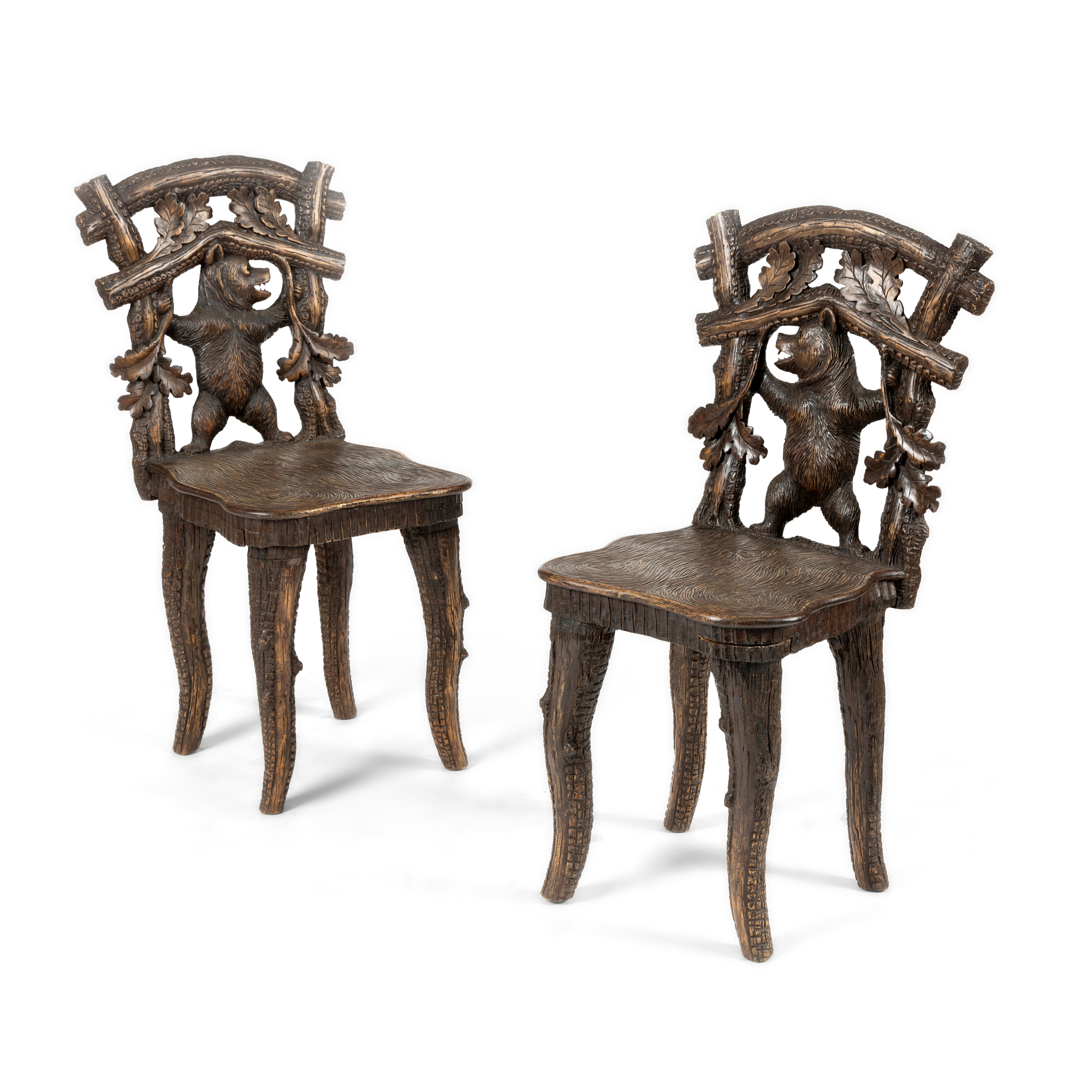 A PAIR OF BLACK FOREST SIDE CHAIRS