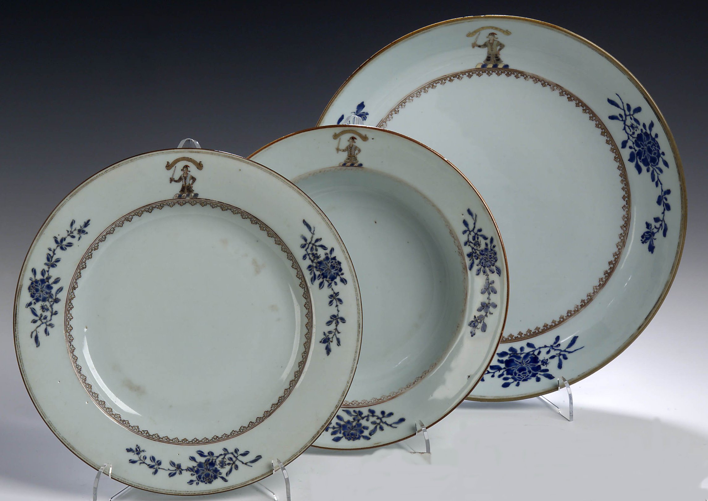 A Chinese 18th century export armorial part dinner service,