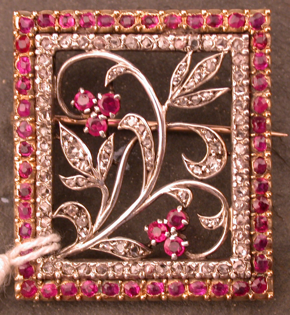 An early 20th century ruby and diamond set brooch