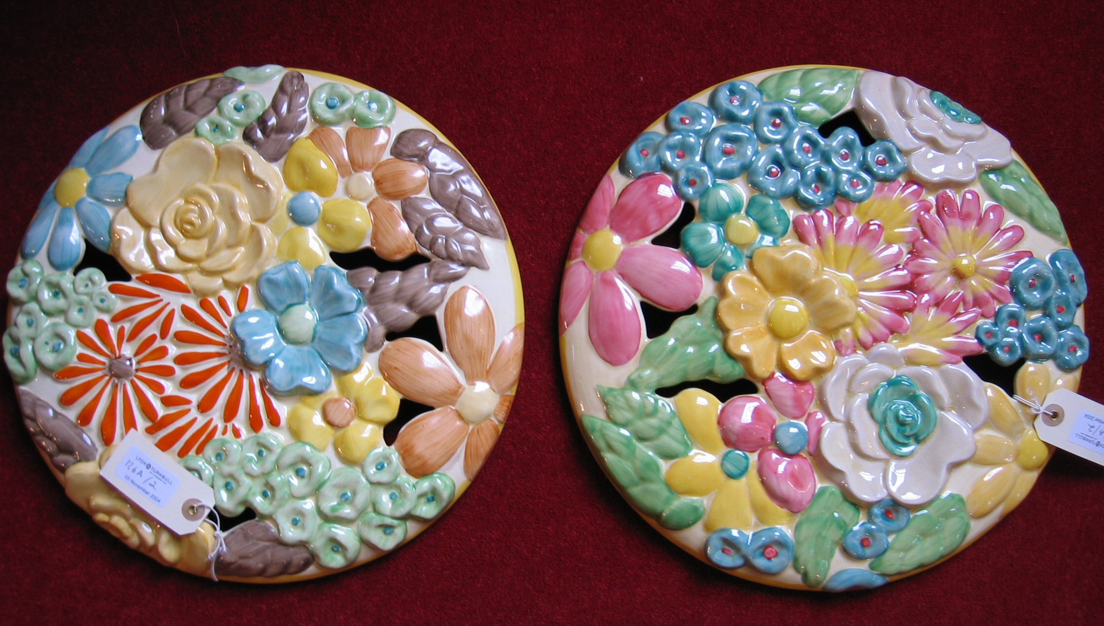 Two Clarice Cliff 'Bouquet' wall plaques,