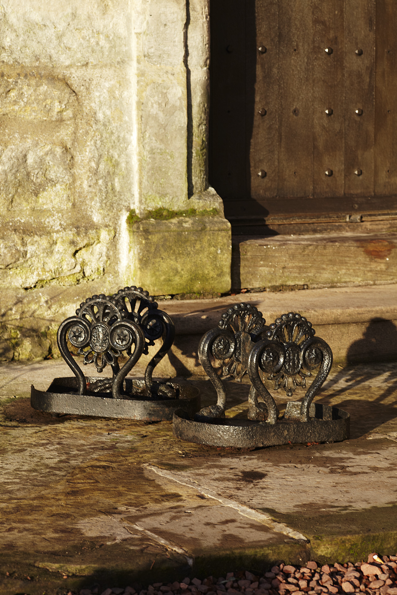 PAIR OF REGENCY BLACK PAINTED CAST IRON BOOTSCRAPES