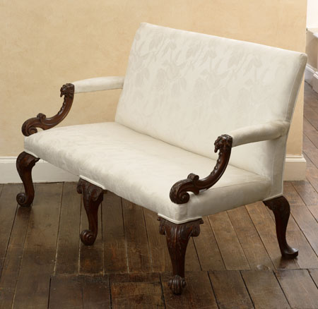 A Victorian mahogany and upholstered settee