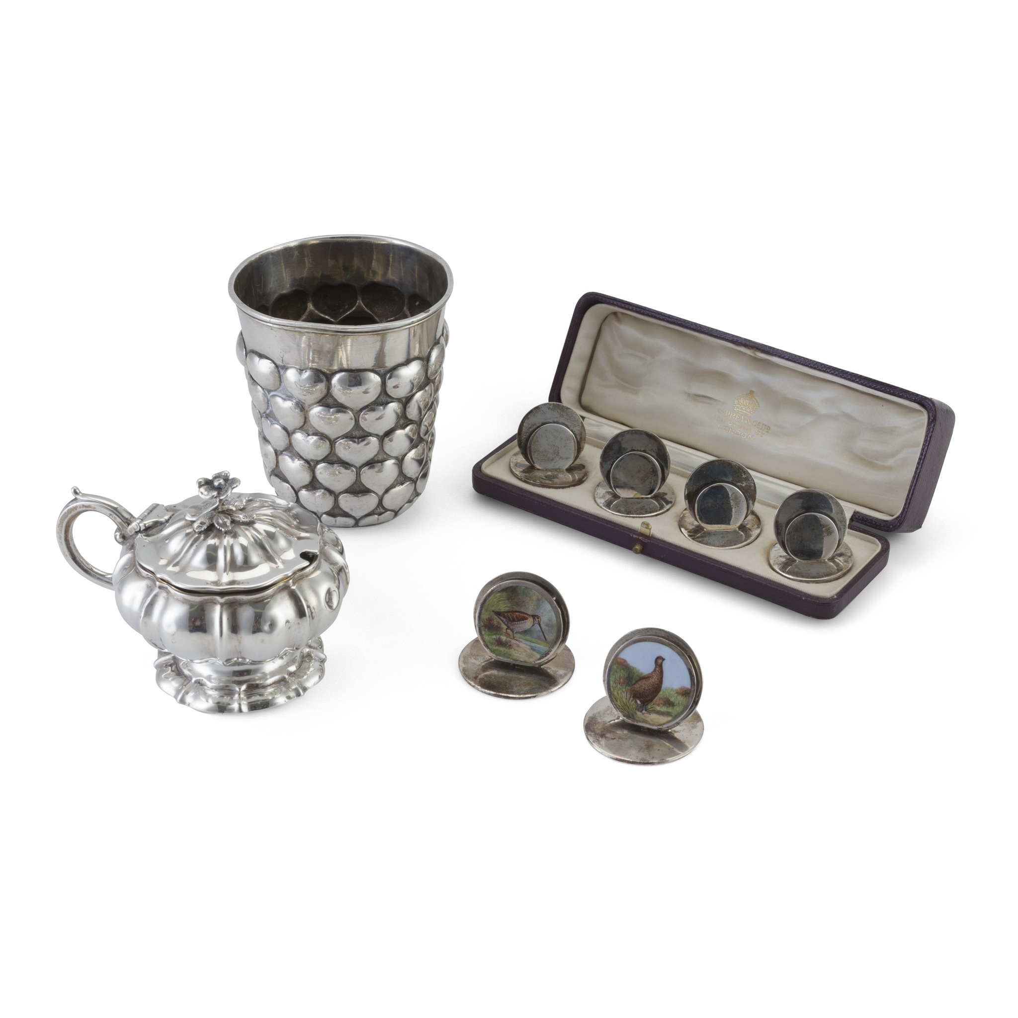 A cased set of four menu holders