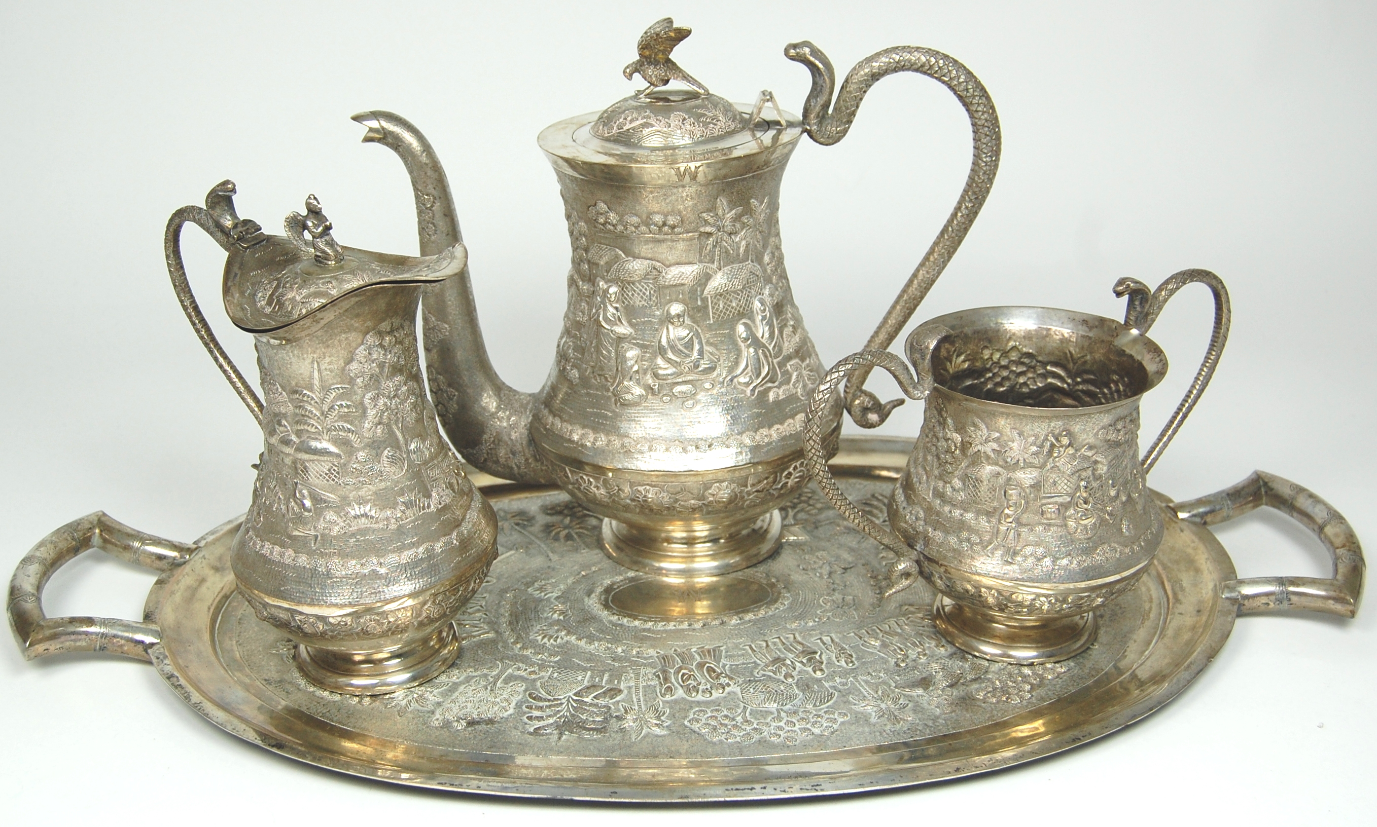 An Indian white metal coffee set and tray