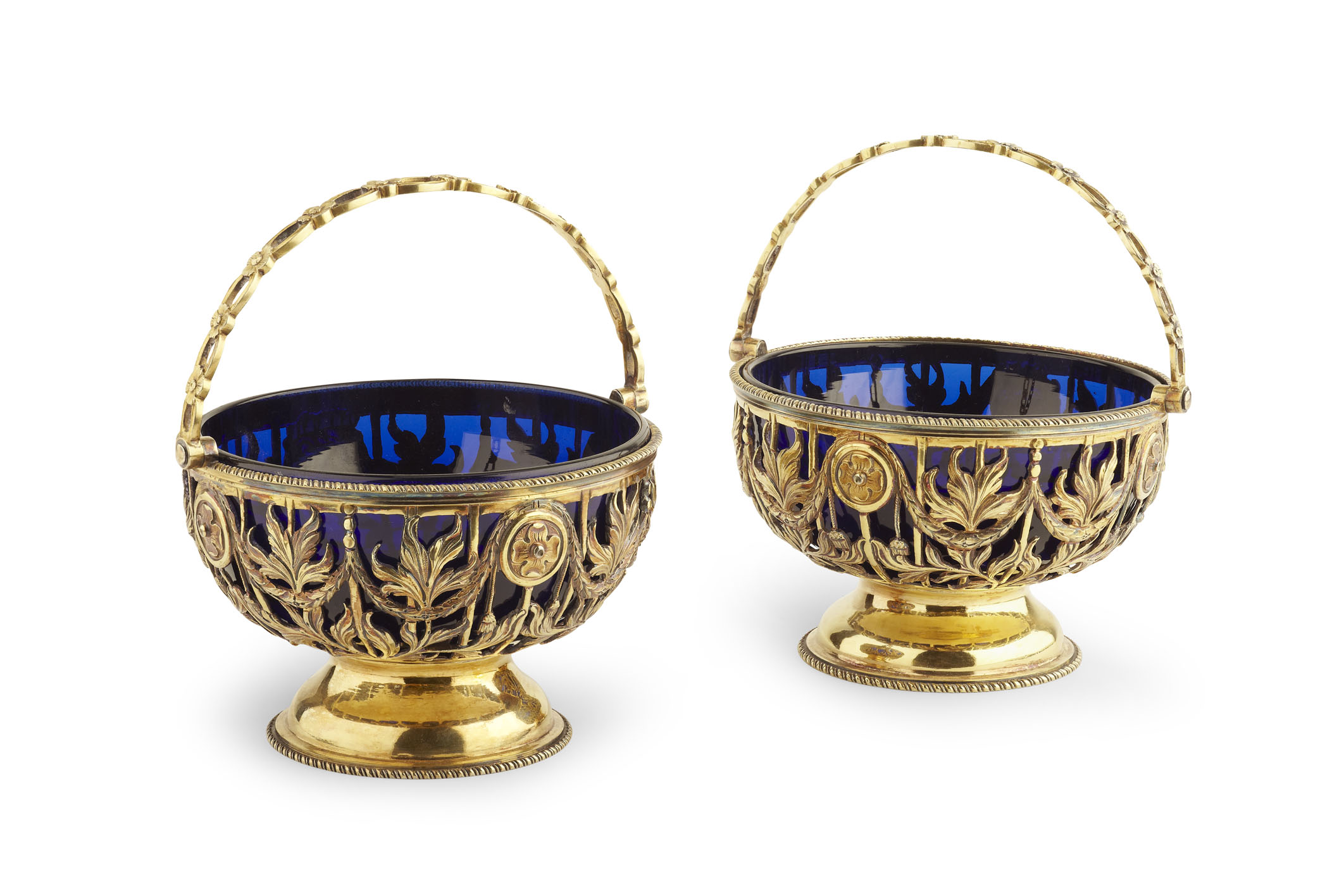 A pair of European silver gilt swing handled bon-bon dishes