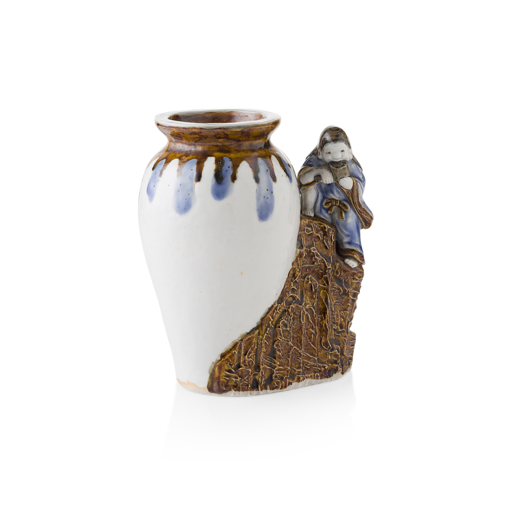 HIRADO PORCELAIN OKIMONO OF A MAN AND HIS WINE JAR