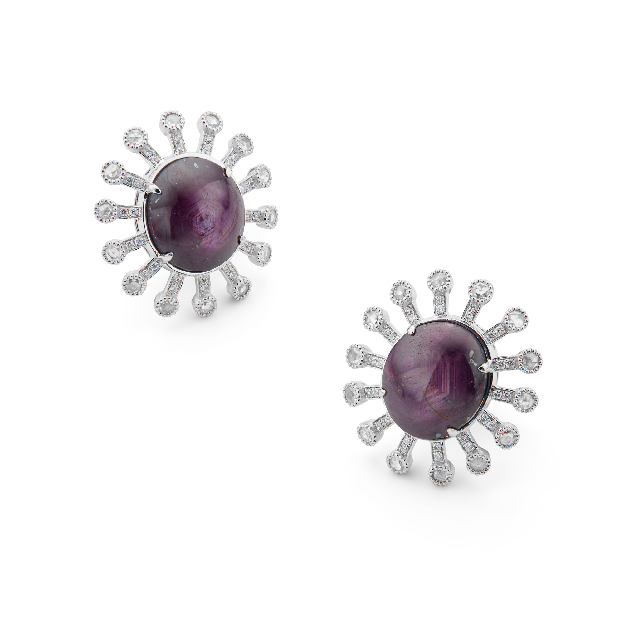A pair of ruby and diamond cluster earrings