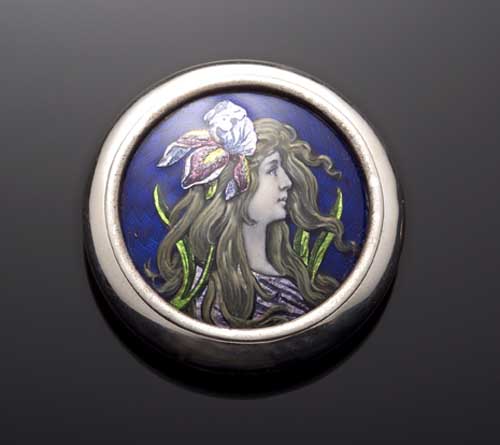 An Art Nouveau silver and enamel pill box and cover,