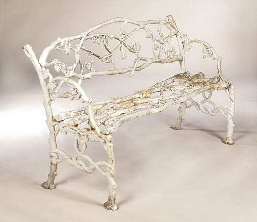 A Victorian overpainted cast iron garden bench,