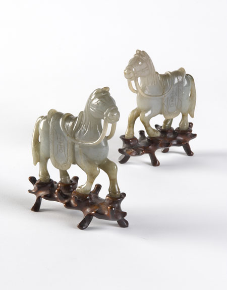 A pair of Chinese green jade carved models of horses