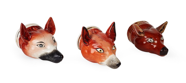 THREE STAFFORDSHIRE POTTERY FOX HEAD STIRRUP CUPS