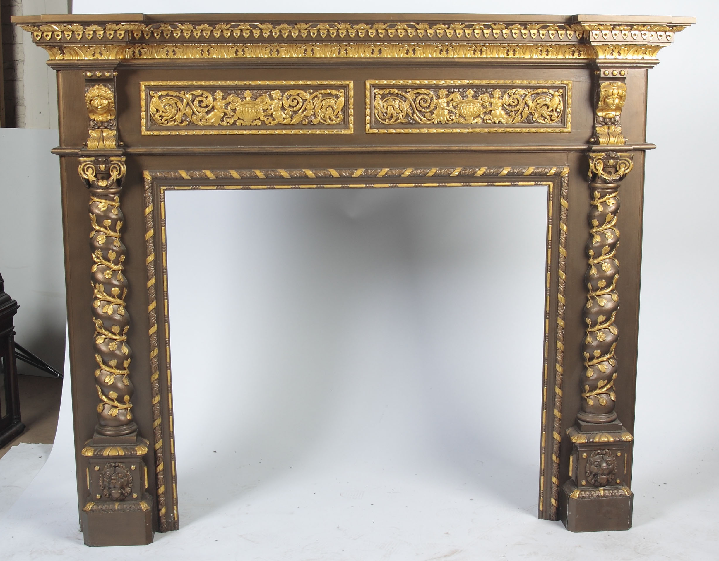 A 19th century carved and overpainted pine chimneypiece