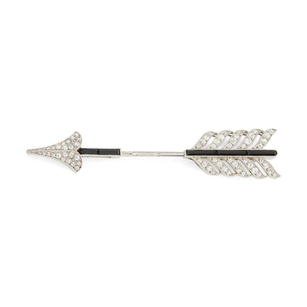 A French Art Deco diamond and onyx set jabot pin