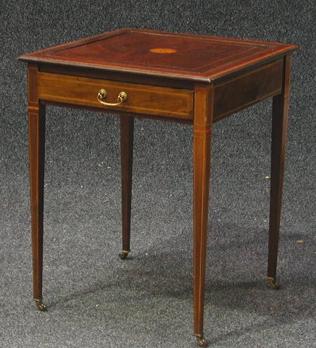 An Edwardian crossbanded and inlaid mahogany games table,