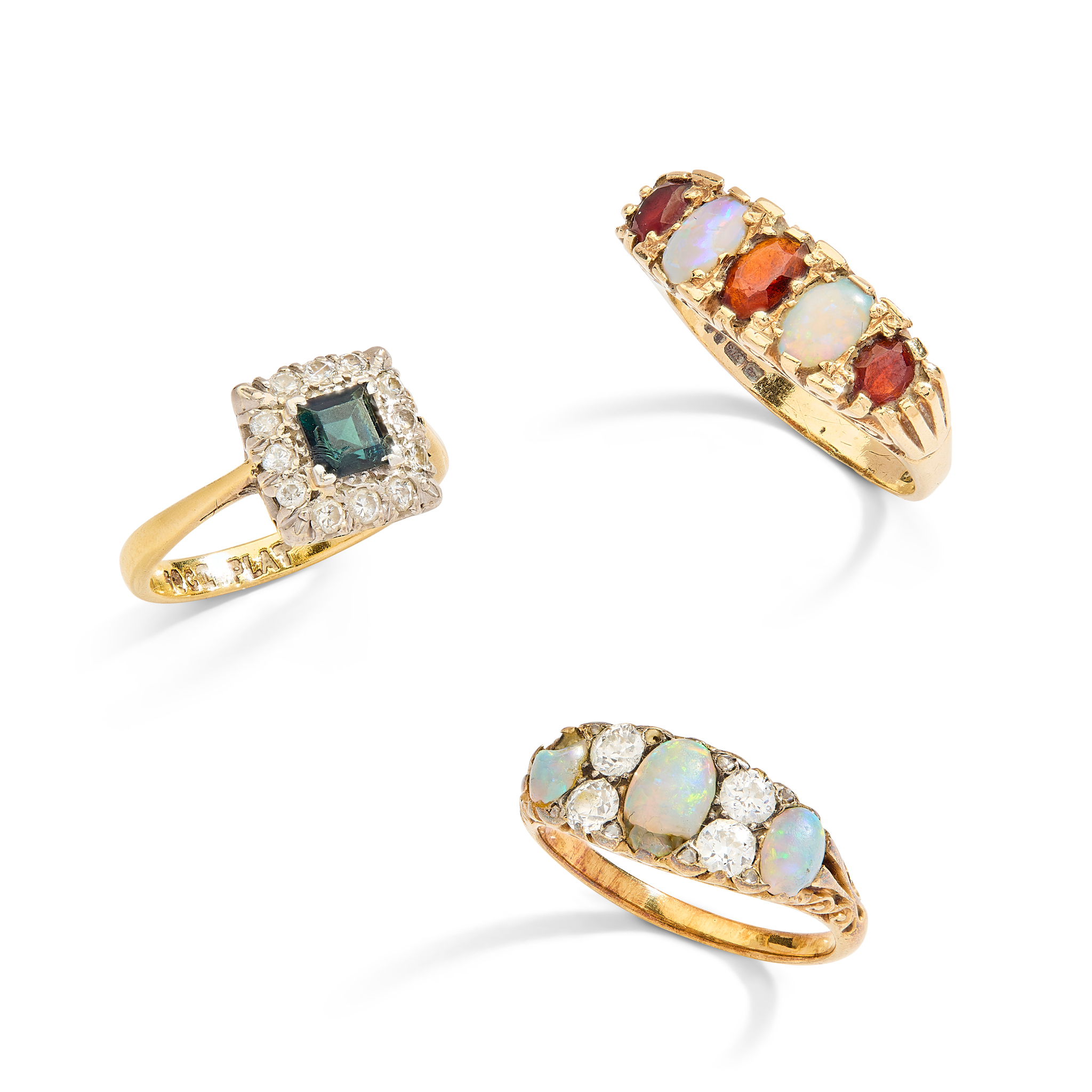 An opal and diamond ring and two others