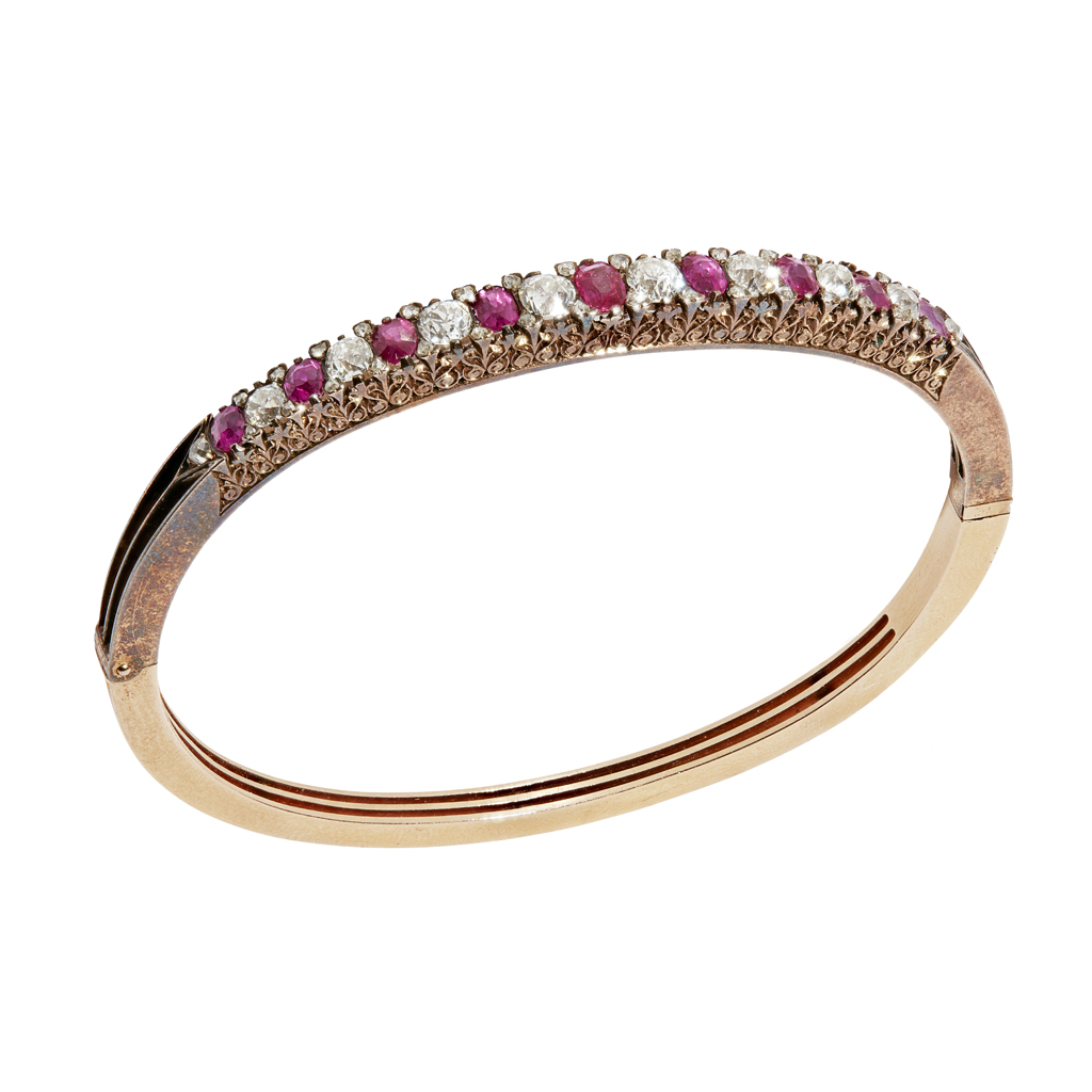 A ruby and diamond set hinged bangle