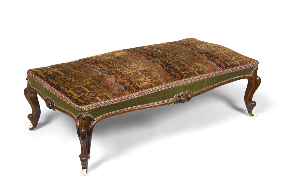 A Victorian rosewood long footstool, circa 1860