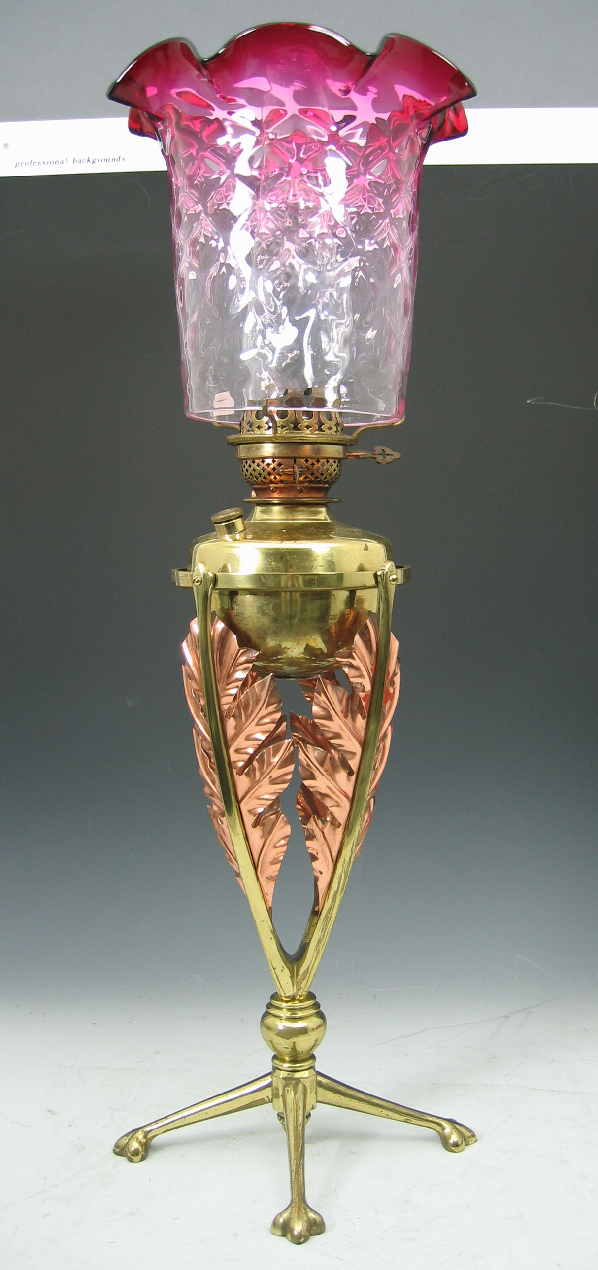 A W.A.S. Benson & Co. brass and copper mounted oil lamp,