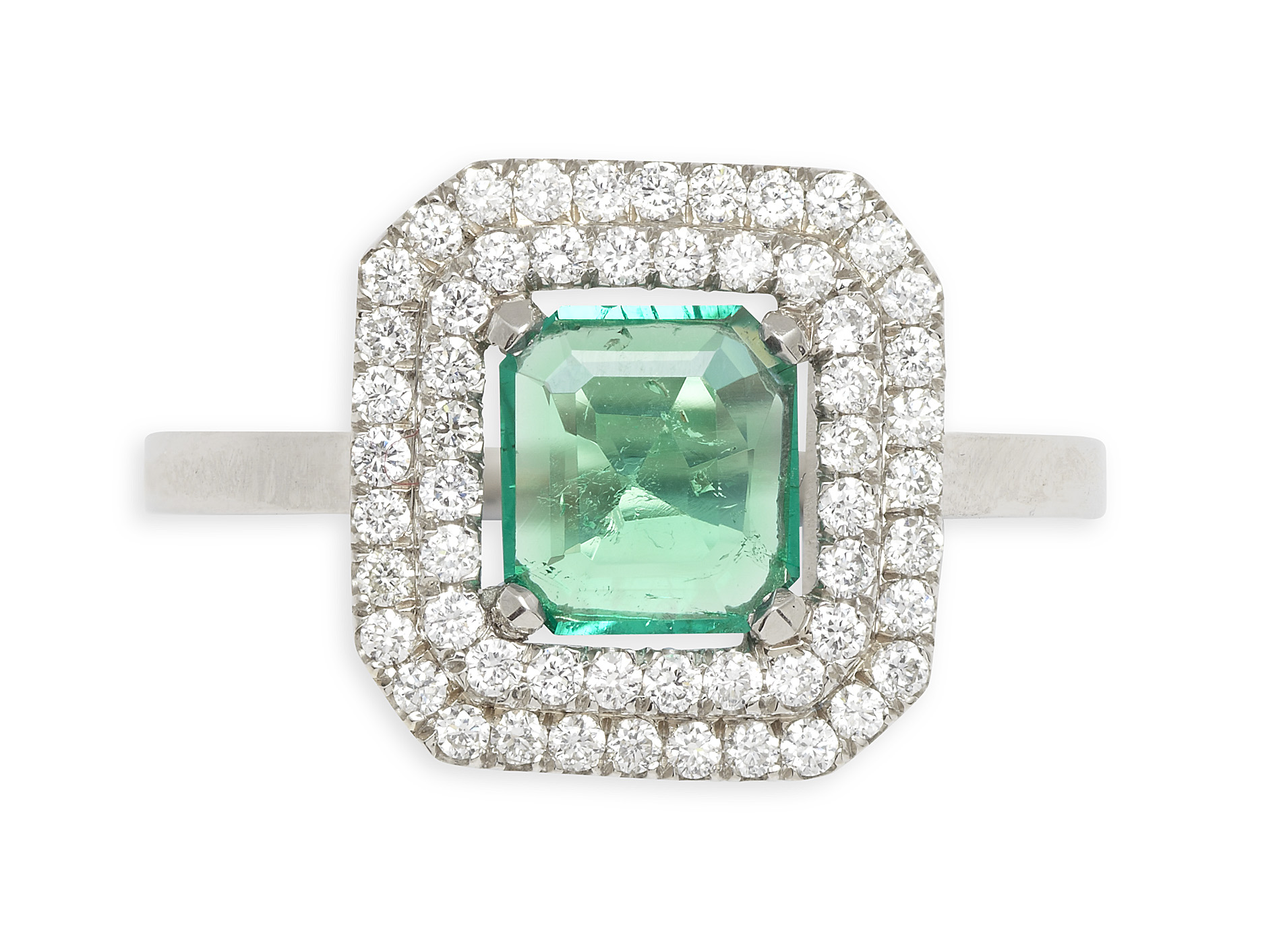 An emerald and diamond set ring
