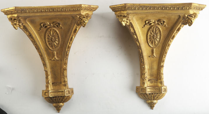A pair of George III style giltwood wall brackets