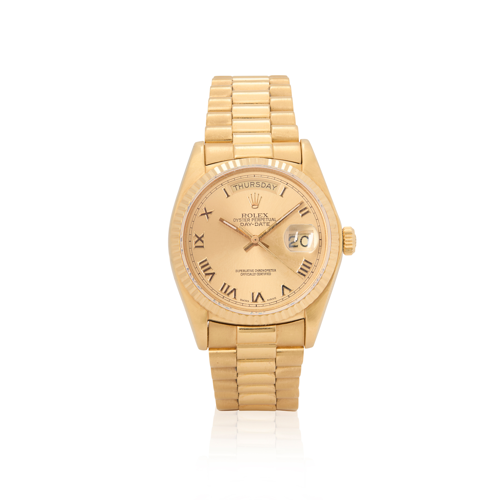 Rolex. An iconic 18k gold automatic wristwatch with day and date