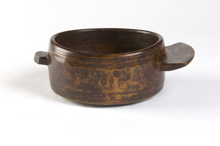 A Scandinavian stained birch high-sided treen bowl