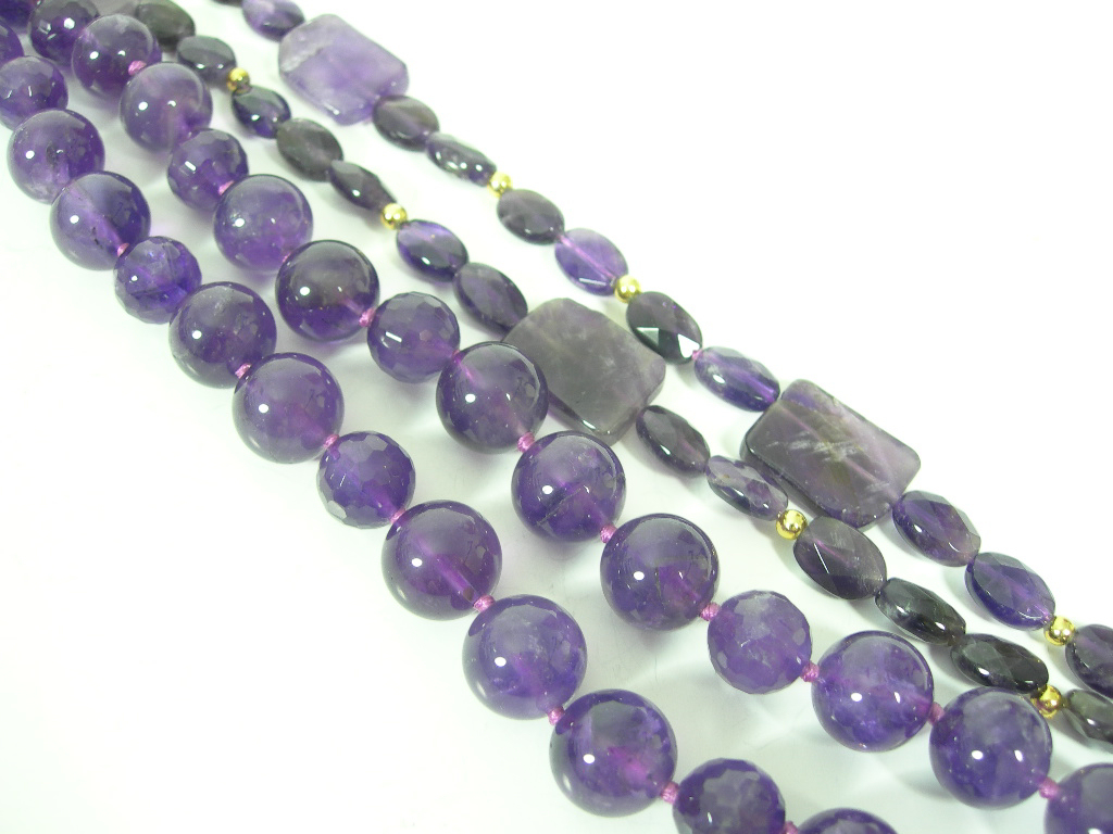 An amethyst bead necklace,