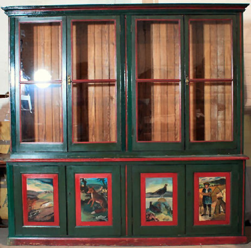 A Victorian over painted pitch pine bookcase
