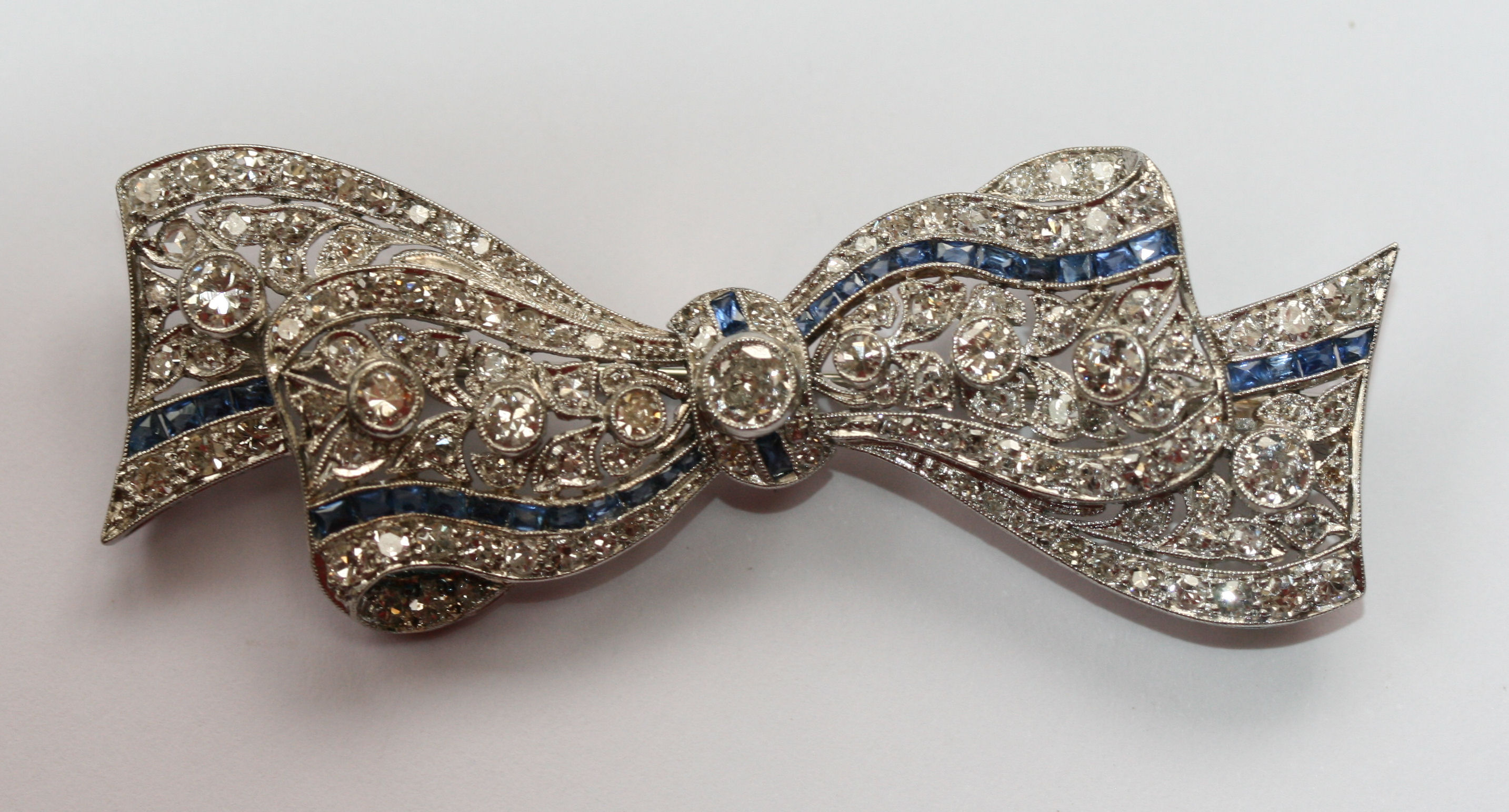 An early 20th century sapphire and diamond set brooch