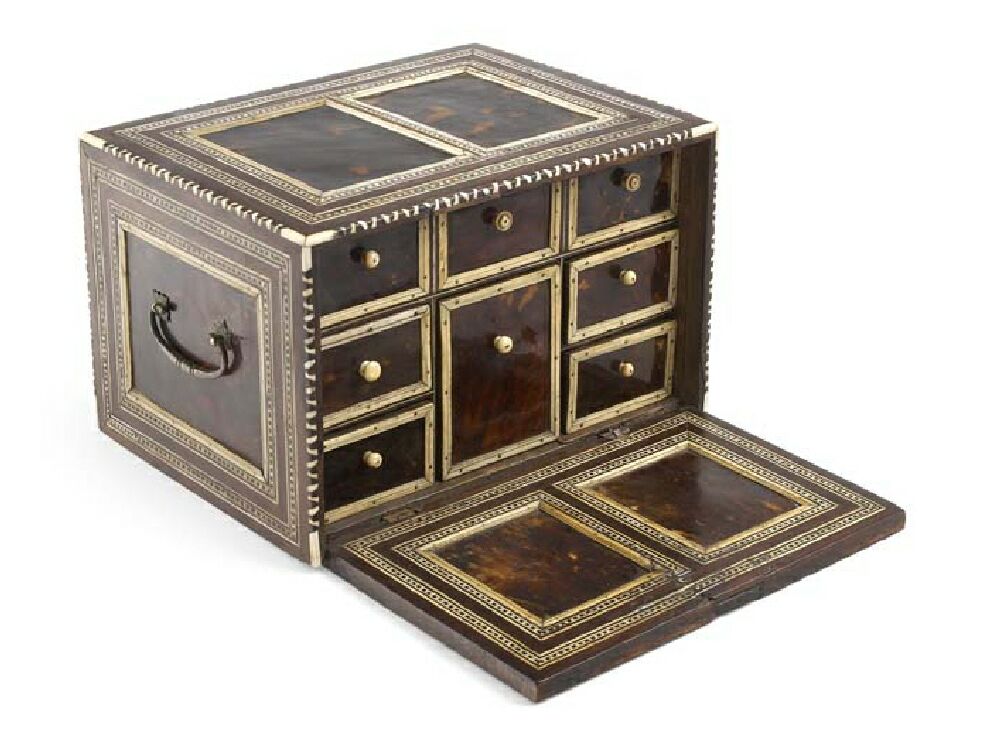 An early 18th century Indo-Portuguese tortoise shell and ivory table cabinet