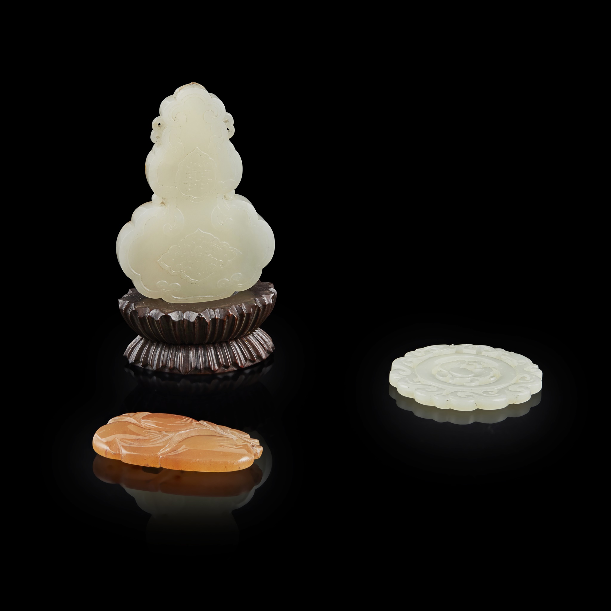 THREE JADE AND HARDSTONE PENDANTS