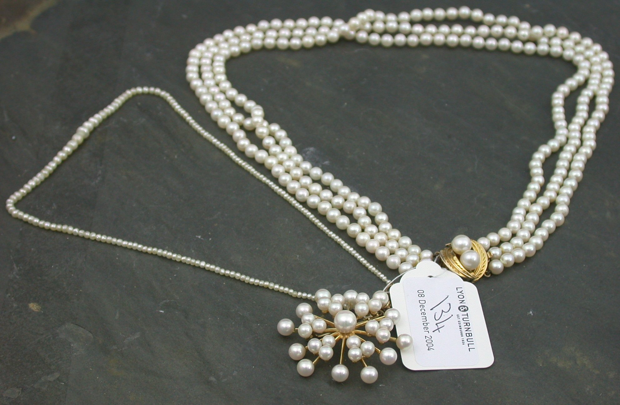 A continental gold mounted cultured pearl brooch,