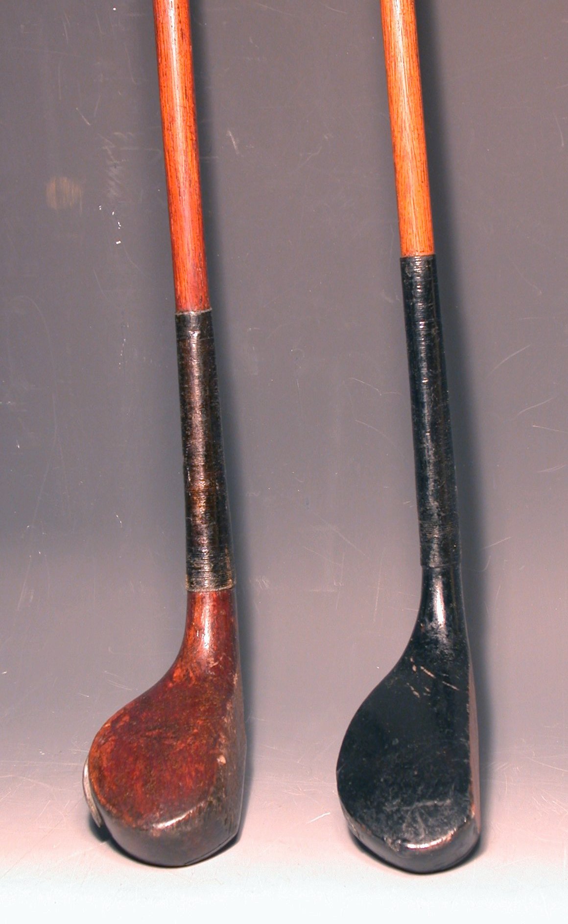 A scared head, ebonised fruitwood putter,