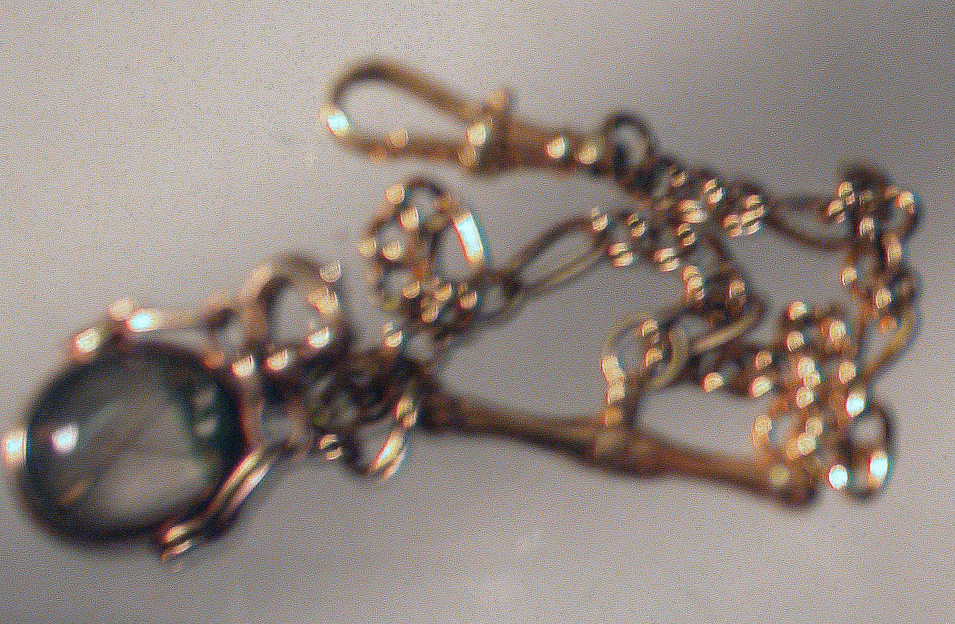 A late Victorian oval golfing swivel fob of Essex crystal form,