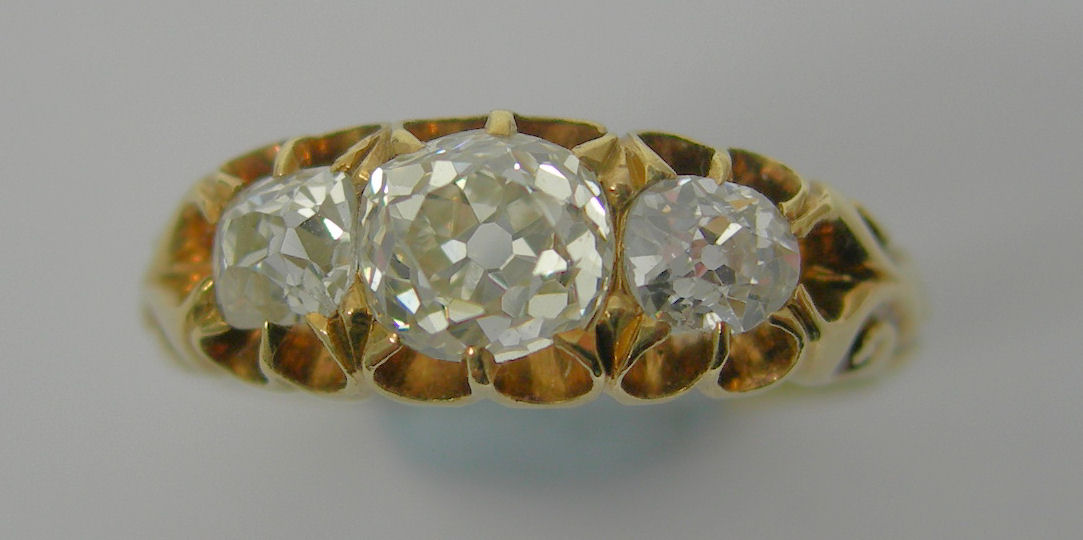 A Victorian 18ct gold mounted diamond three-stone ring,