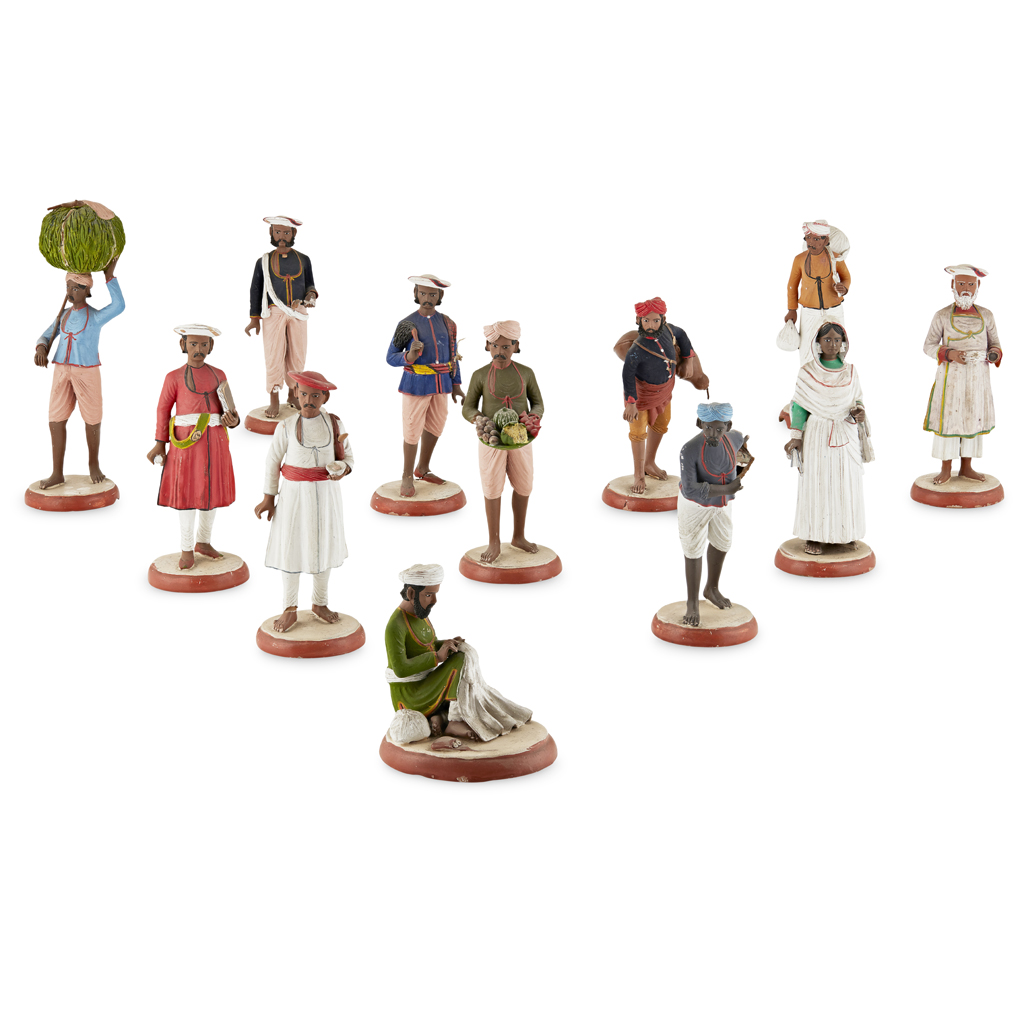 TWELVE INDIAN PAINTED TERRACOTTA AND STUCCO FIGURES