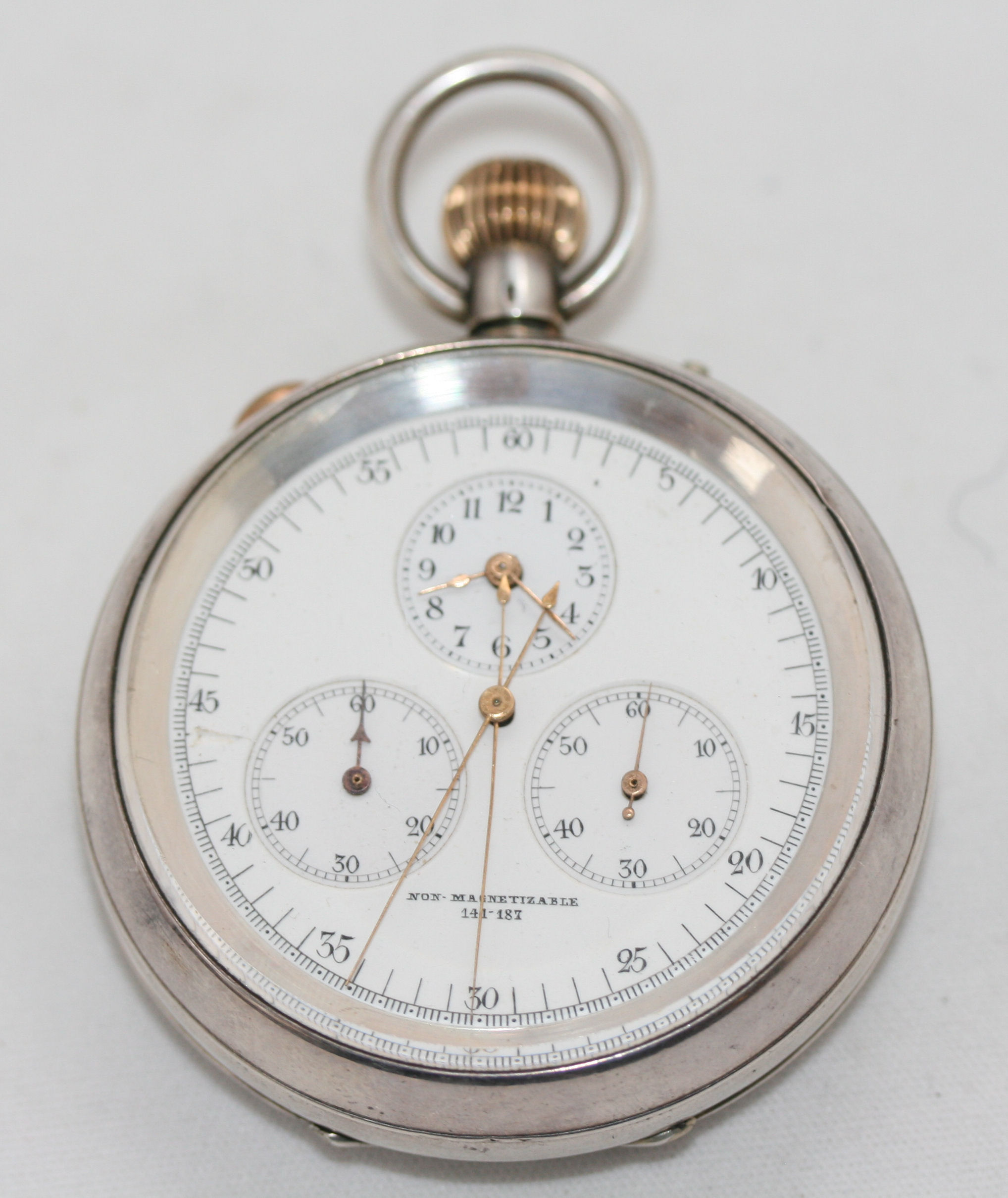 S. SMITH & SON - a silver cased open faced split second chronograph